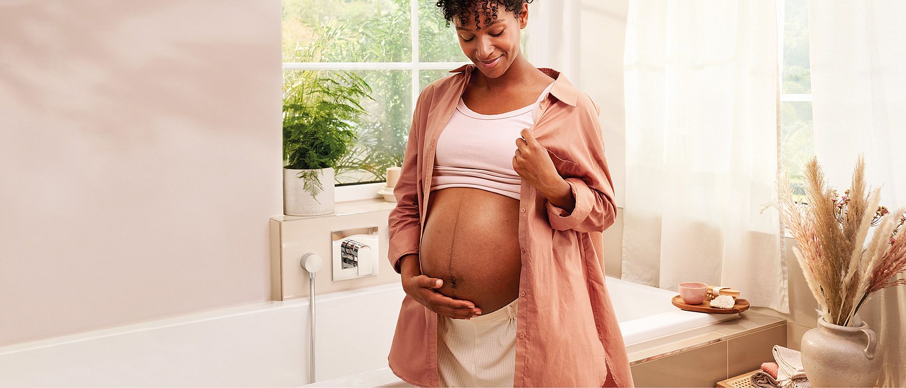 Pregnant woman in the bathroom