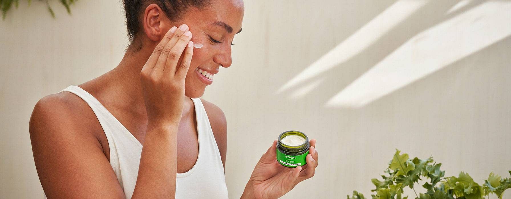 Woman using skinfood face care on her face
