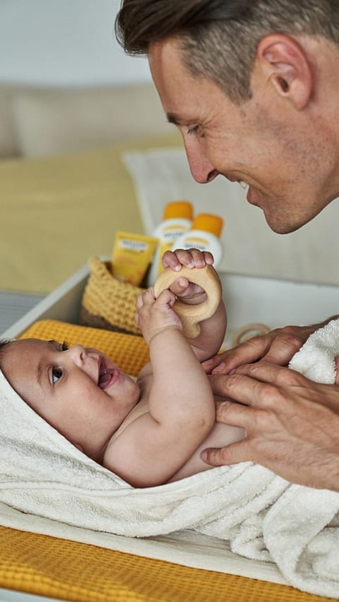 father_baby_nappy_change