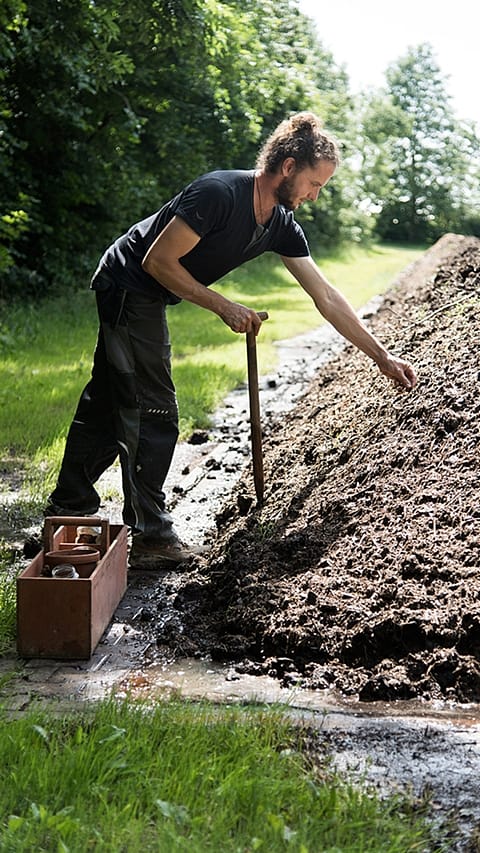 gardener_next_to_compost
