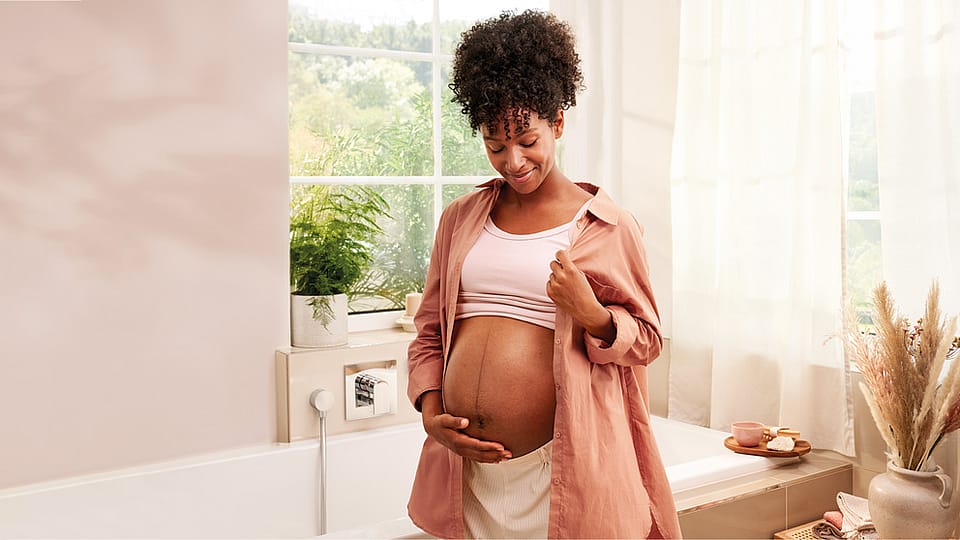 Pregnant woman in the bathroom