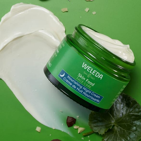 Skinfood night cream on green background
