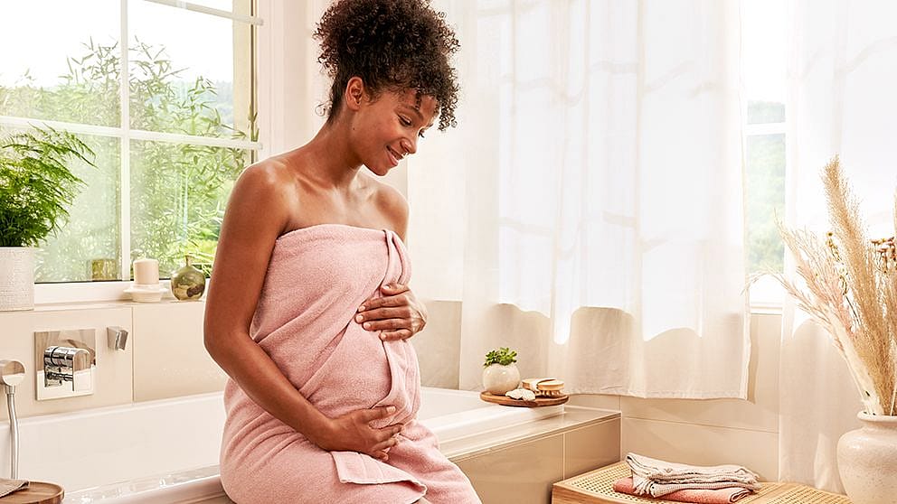 pregnant_woman_wrapped_in_towel