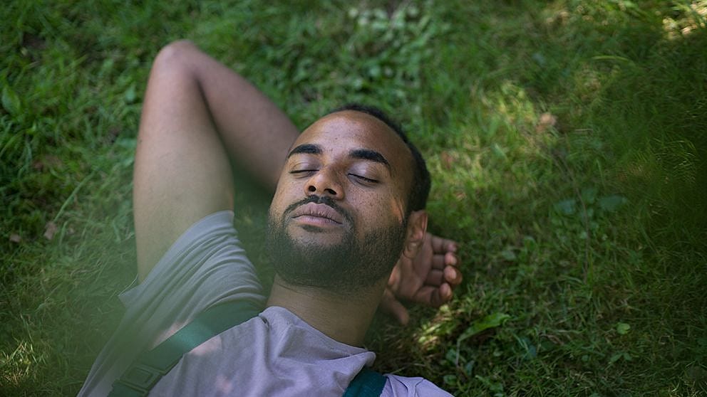 man_lying_on_grass