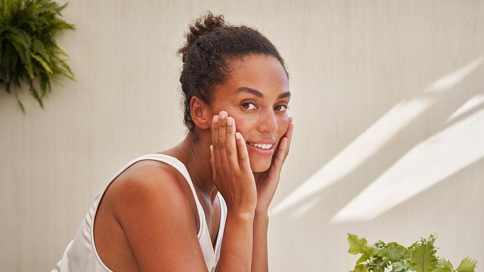 woman applying balm