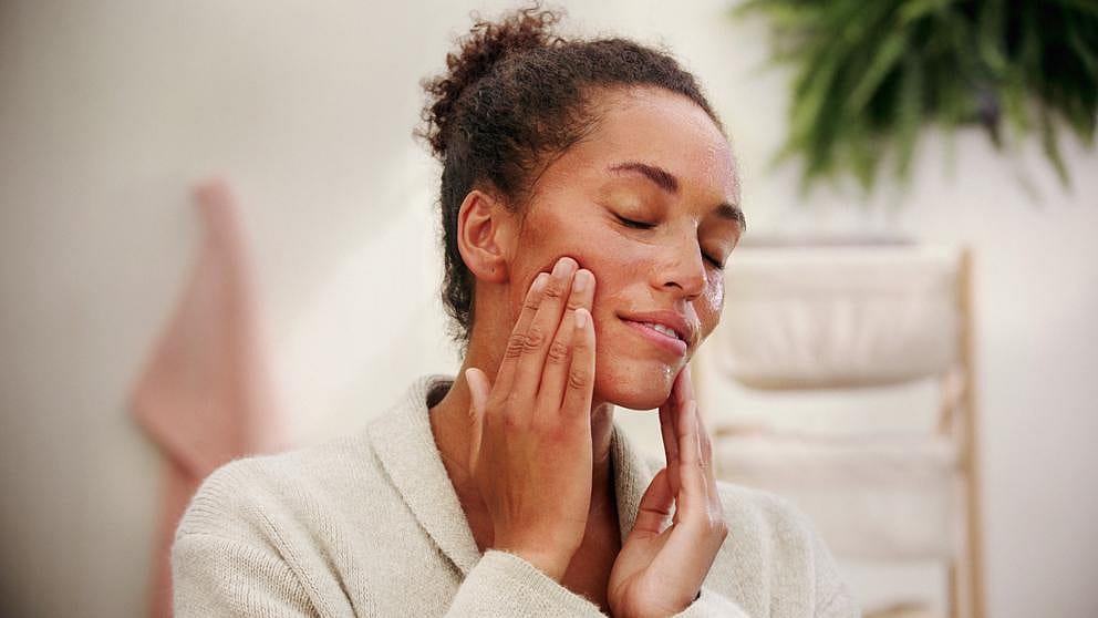 woman touching face