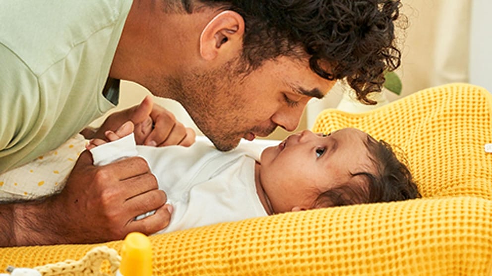 father_baby_cuddle_square